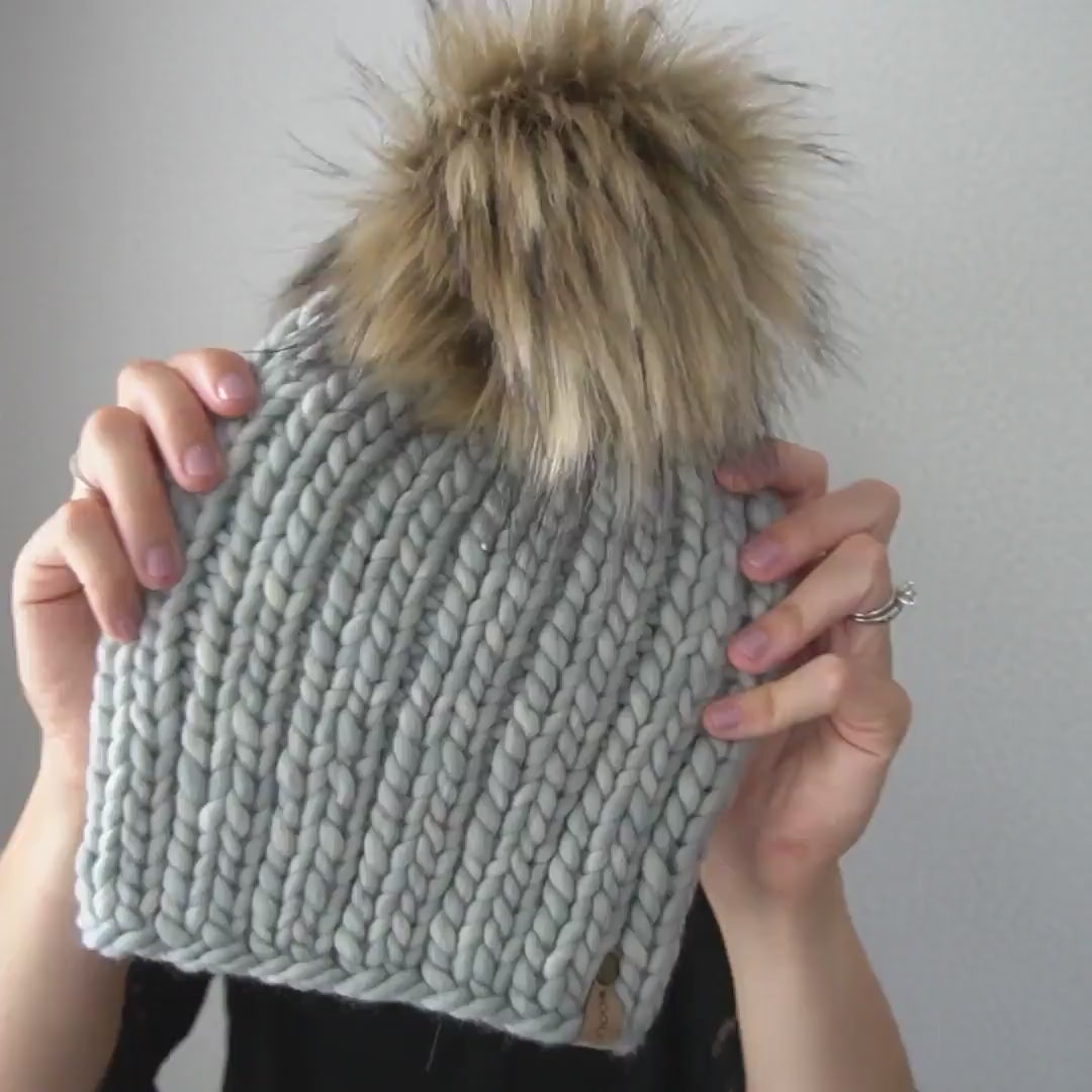 Hand knitted merino selling wool beanie hat with large faux fur pom women teens