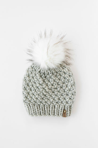 Light Gray Hand Knit Wool Hat with Pom Pom on a white background